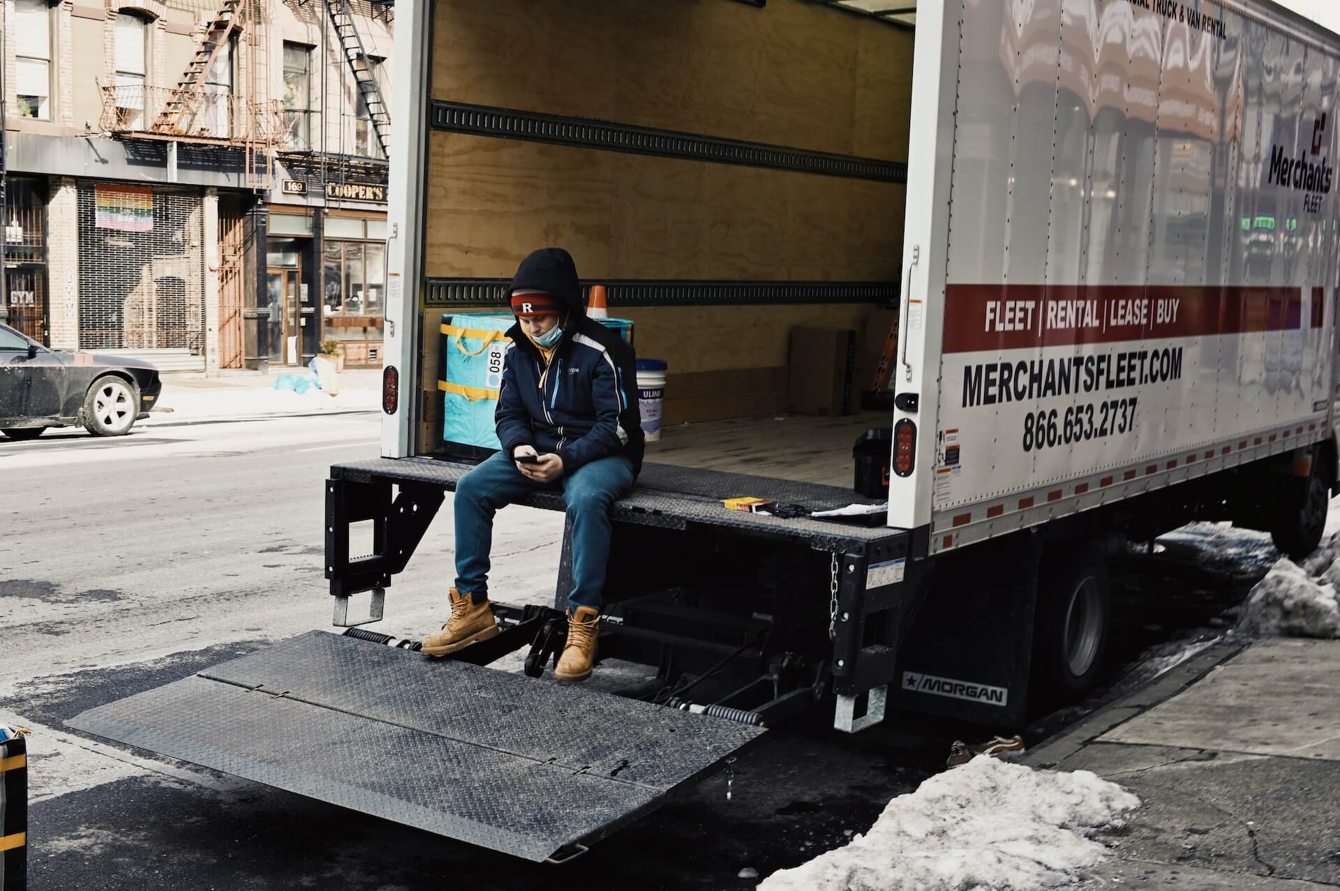 Man sit in a office removal truck