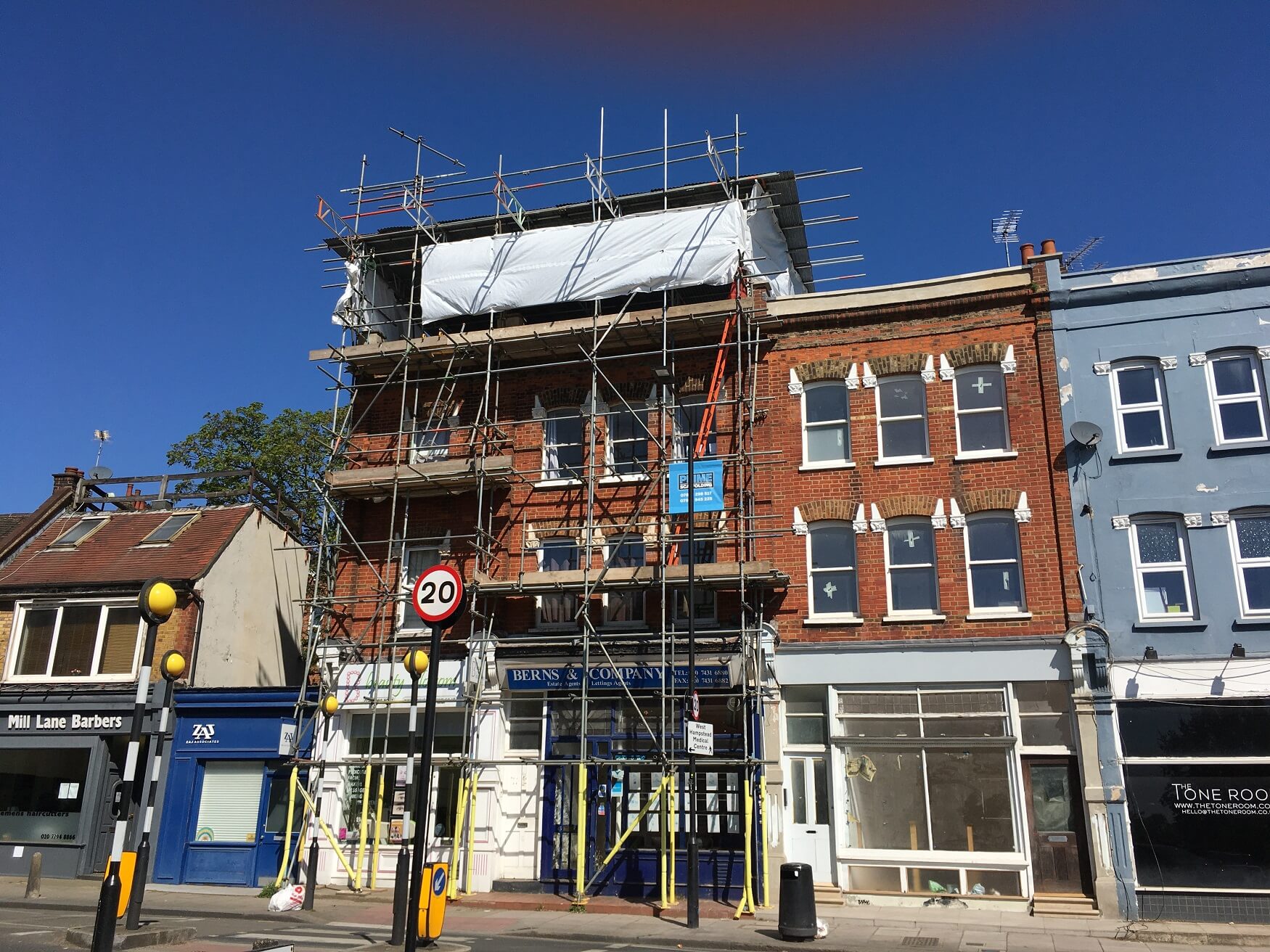 erected scaffolding on high street of London